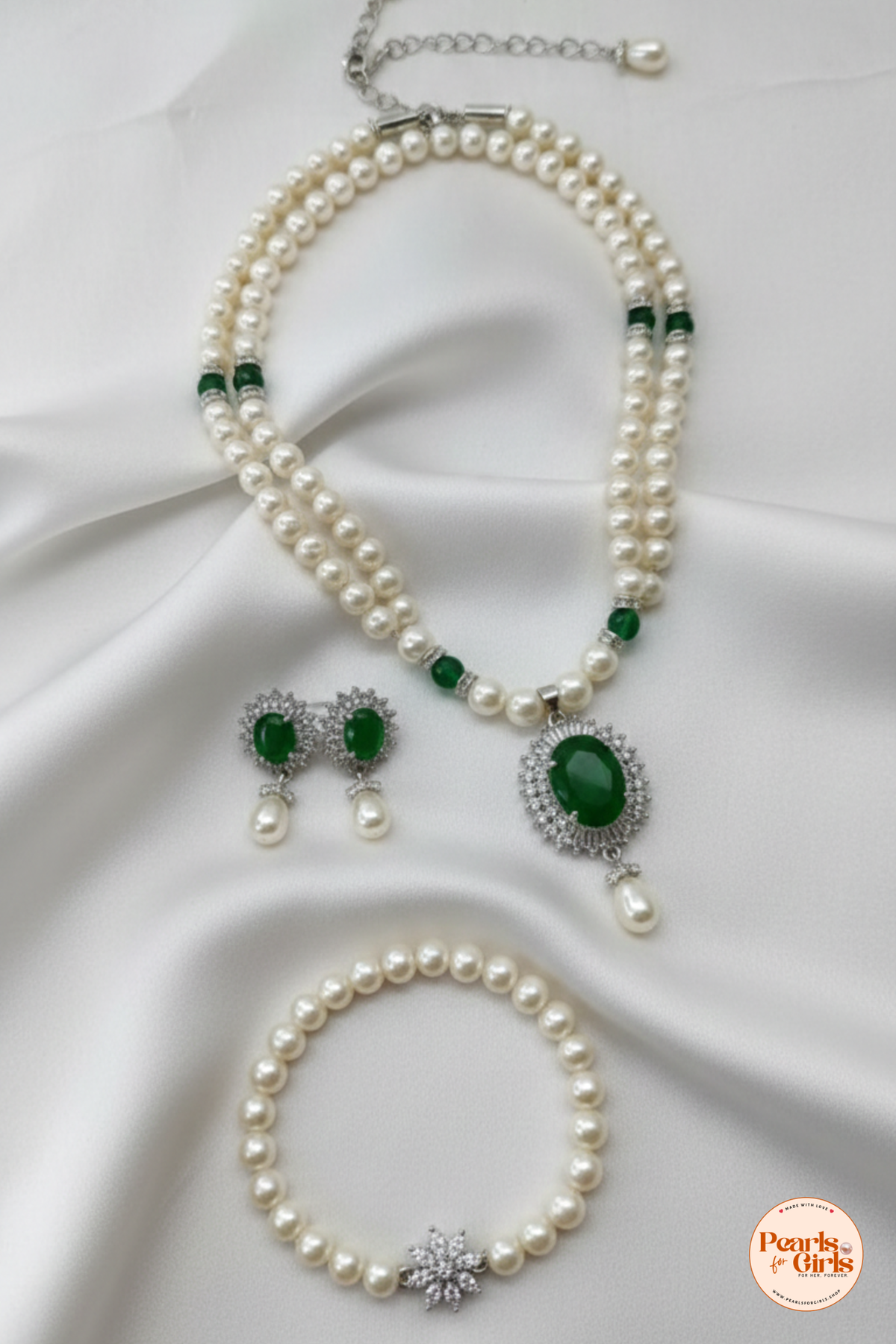 Classic pearl strand with emerald green stone centre piece