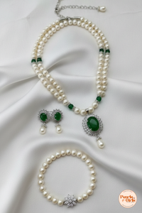 Classic pearl strand with emerald green stone centre piece