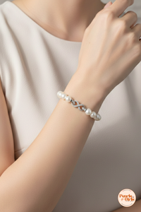 Elegant White Pearl Bracelet with Silver Infinity Clasp