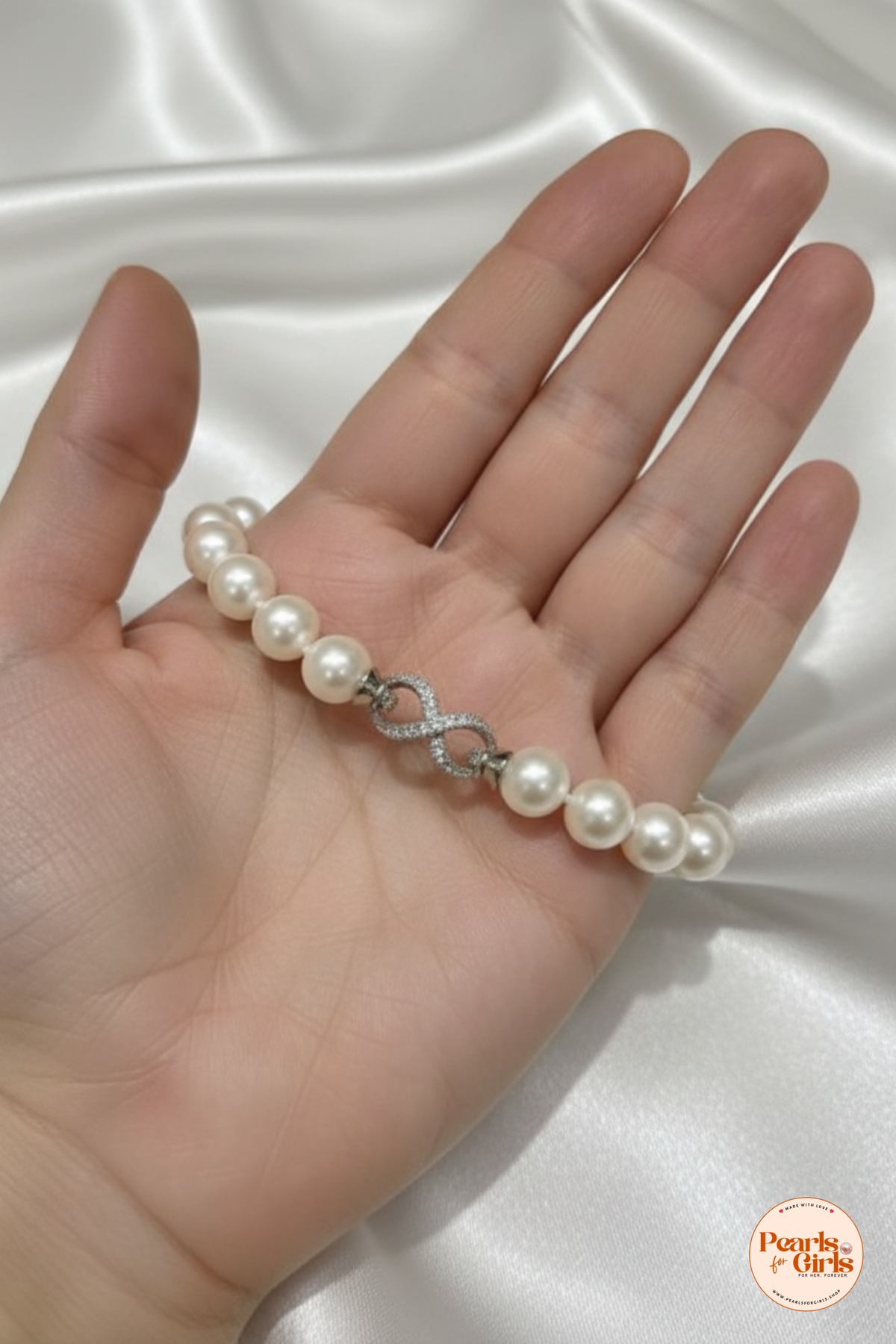 Elegant White Pearl Bracelet with Silver Infinity Clasp