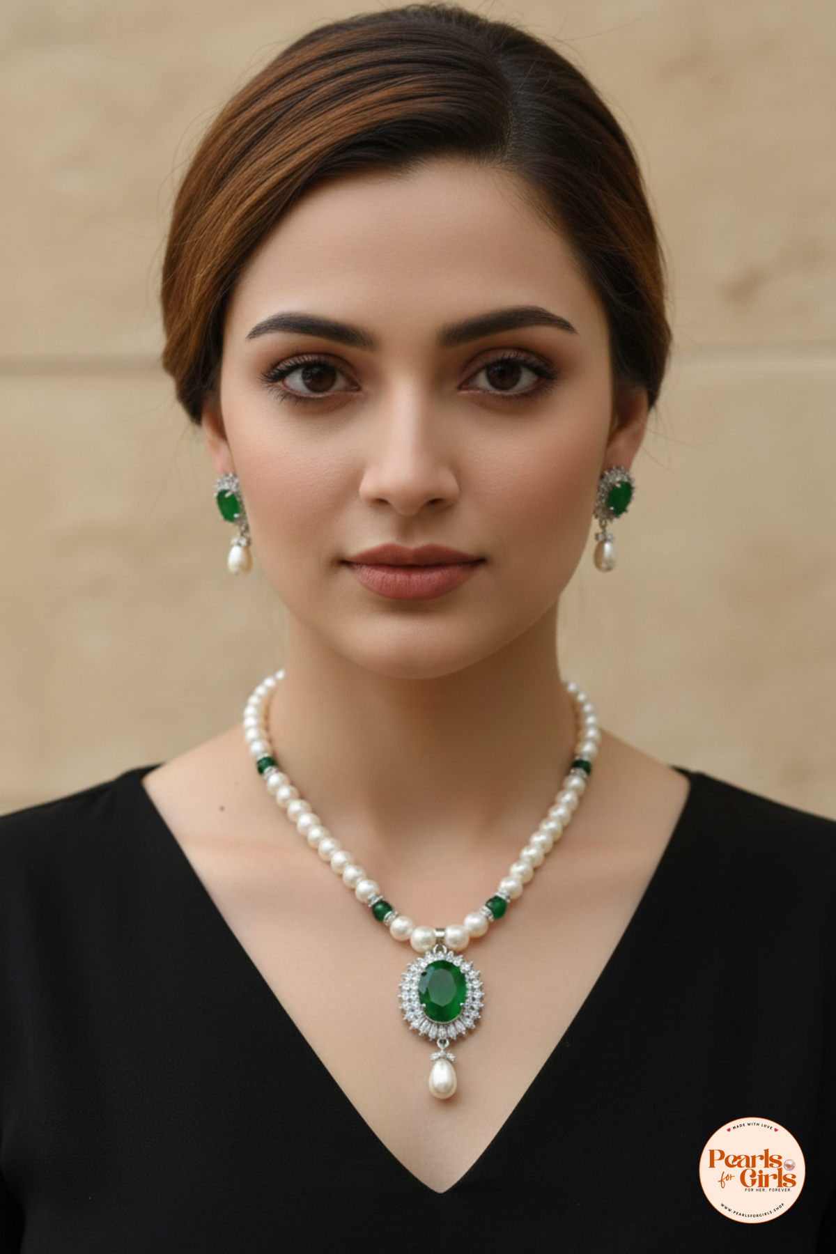 Classic pearl strand with emerald green stone centre piece